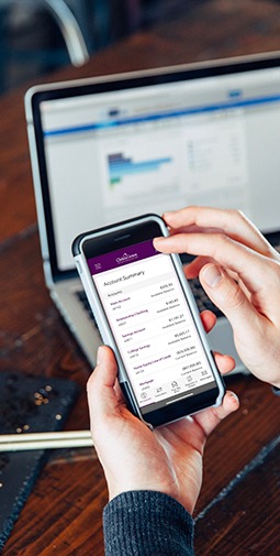 A man looks at his online banking after opening a checking or savings account from his phone.